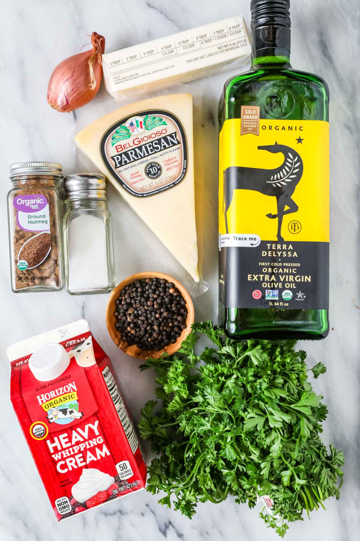 Overhead view of ingredients including parmesan, cream, shallot, and more.