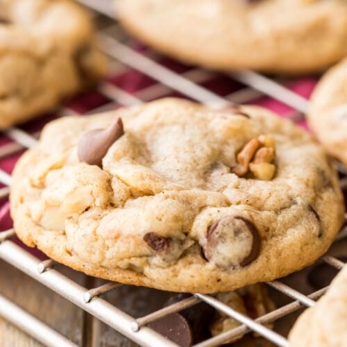 close-up view of a banana cookie studded with chocolate chips and walnuts