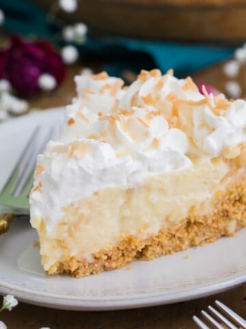 Slice of coconut cream pie on plate