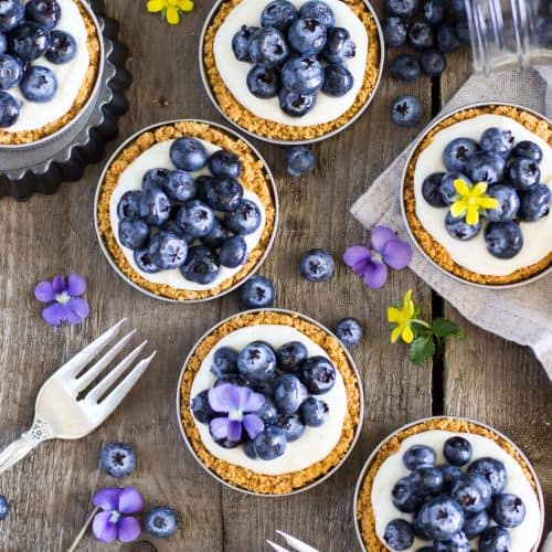 Overhead of blueberry lemon tarts