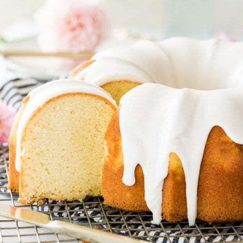 sliced vanilla bundt cake on cooling rack