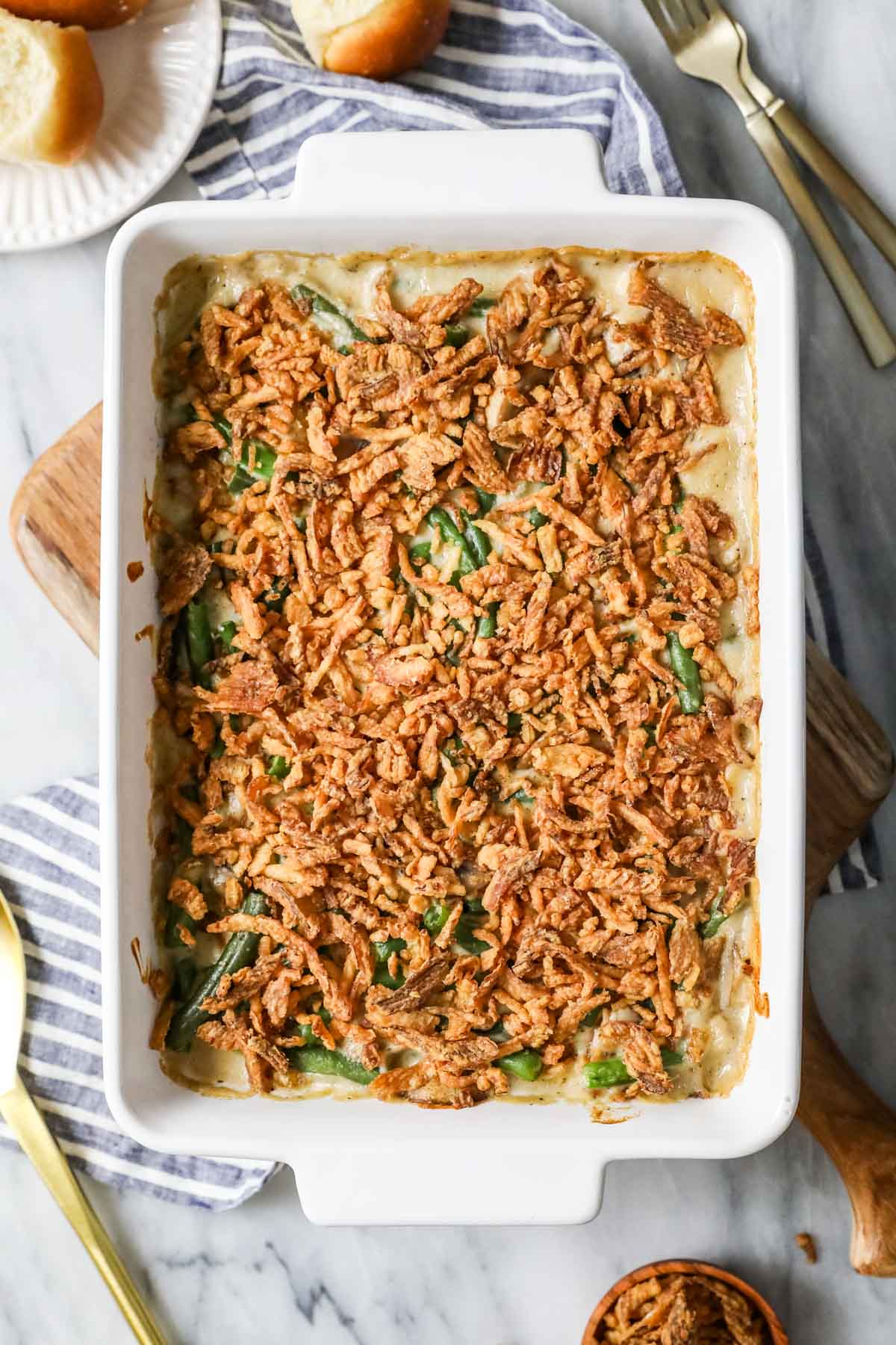 Overhead view of a casserole made with green beans, cream, and french fried onions.