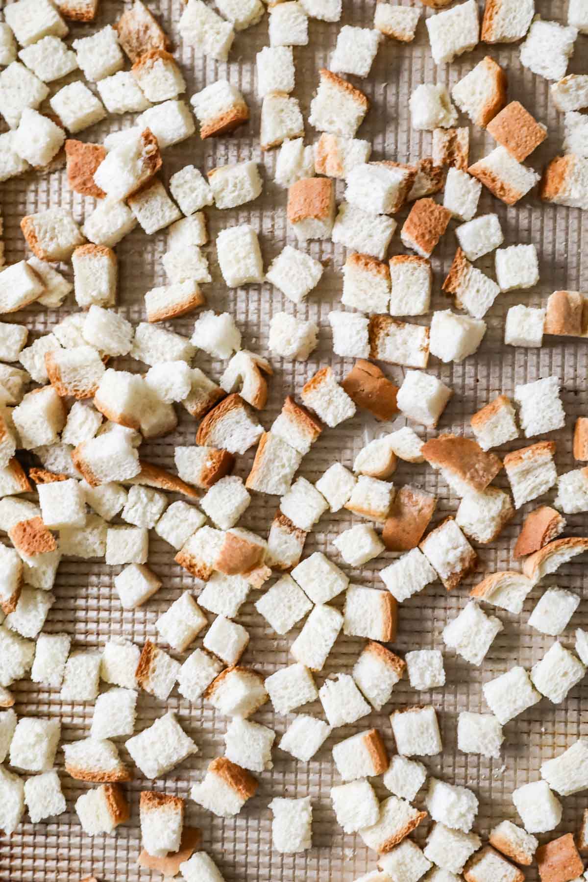 Overhead view of perfectly cut homemade bread cubes for stuffing.