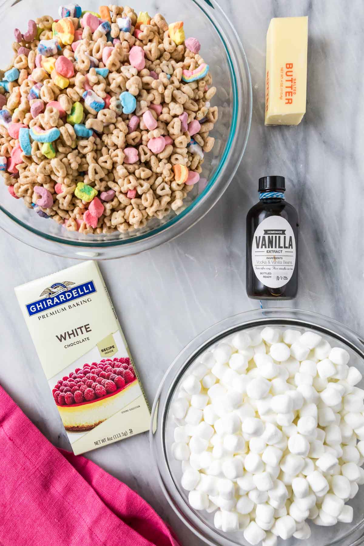 Overhead view of ingredients including lucky charms cereal, marshmallows, and more.
