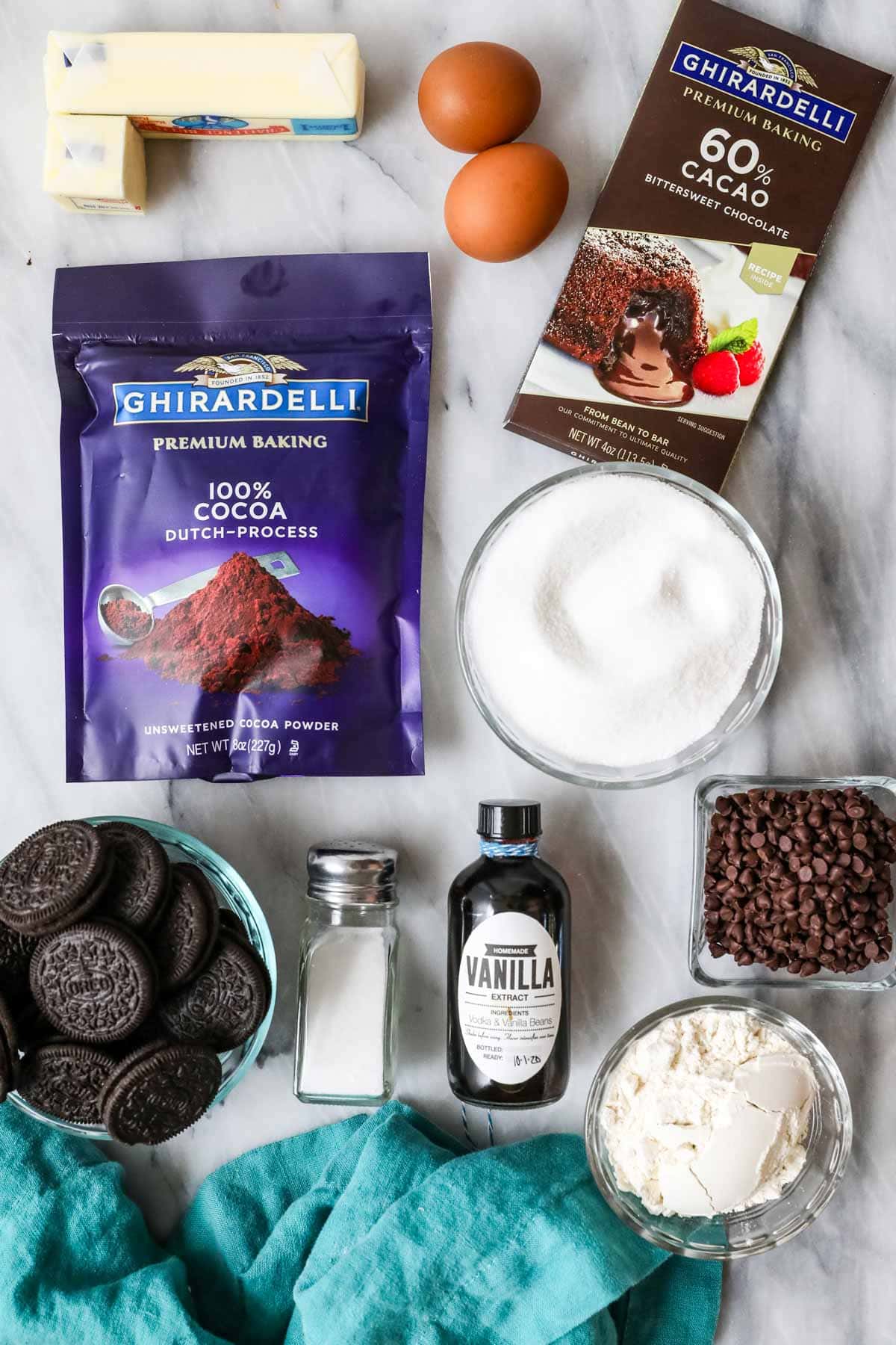 Overhead view of ingredients including cocoa powder, oreos, chocolate chips, and more.