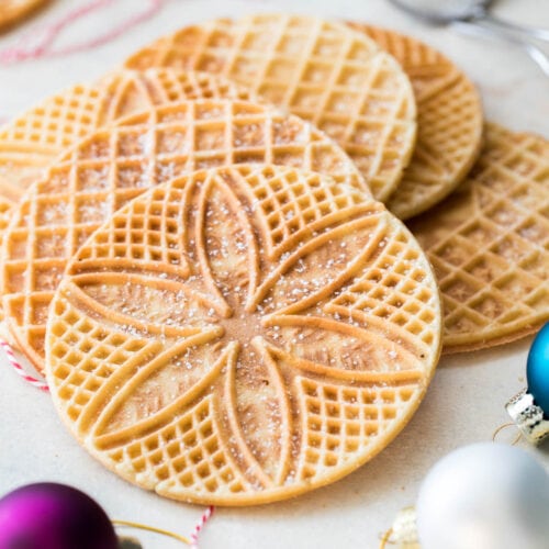 Pizzelle arranged on white board