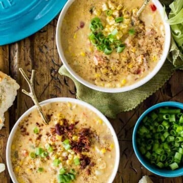 Overhead of two bowls of corn chowder